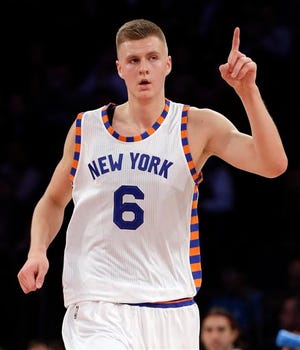 New York Knicks forward Kristaps Porzingis (6) gestures after scoring against the Charlotte Hornets during the first quarter of an NBA basketball game, Tuesday, Nov. 17, 2015, in New York. (AP Photo/Julie Jacobson)