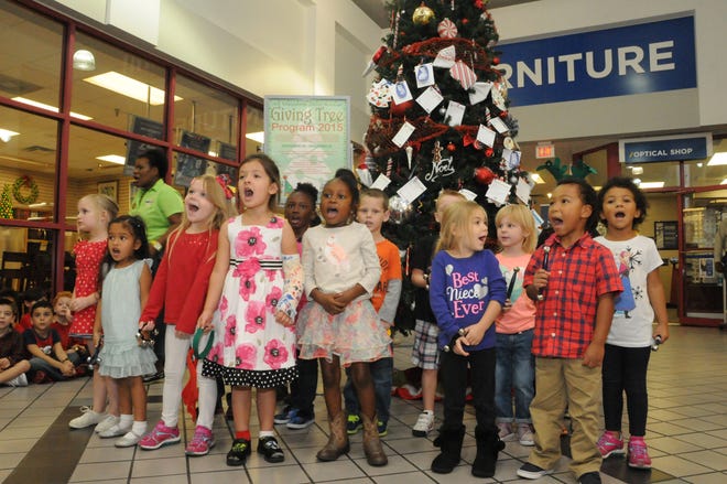 Children from Mayport's Child Development Center help kick off the 22nd anniversary of the Giving Tree Program hosted by Navy Exchange Mayport during a special "Lighting of the Giving Tree" ceremony on Nov. 17.