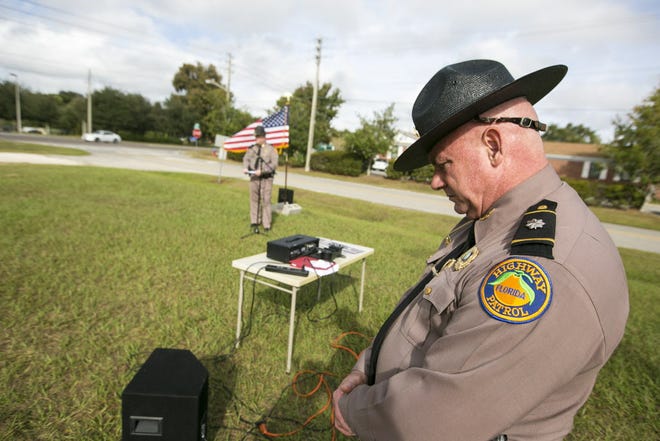 Florida Highway Patrol Lt. Col. Michael Thomas listens during the presentation as a portion of Southeast 25th Avenue was named for Master Trooper Chelsea Richard who was killed on I-75 in 2014.