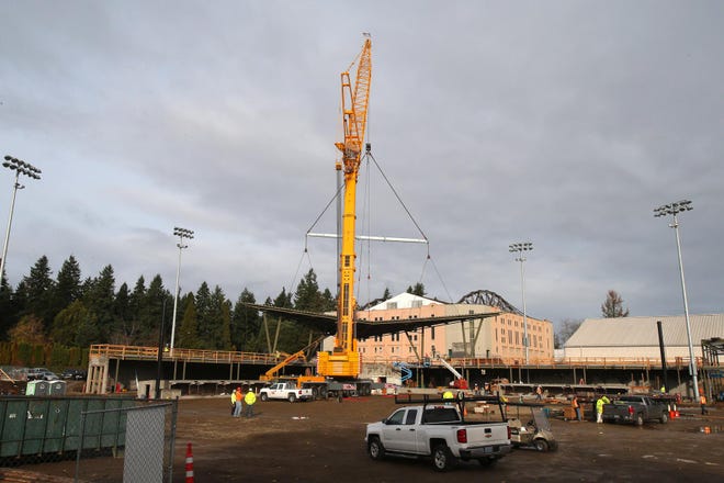 A 600-ton crane lifted the roof into place at Jane Sanders Stadium during construction Tuesday, November 17, 2015 on the University of Oregon campus. (Brian Davies/The Register-Guard)