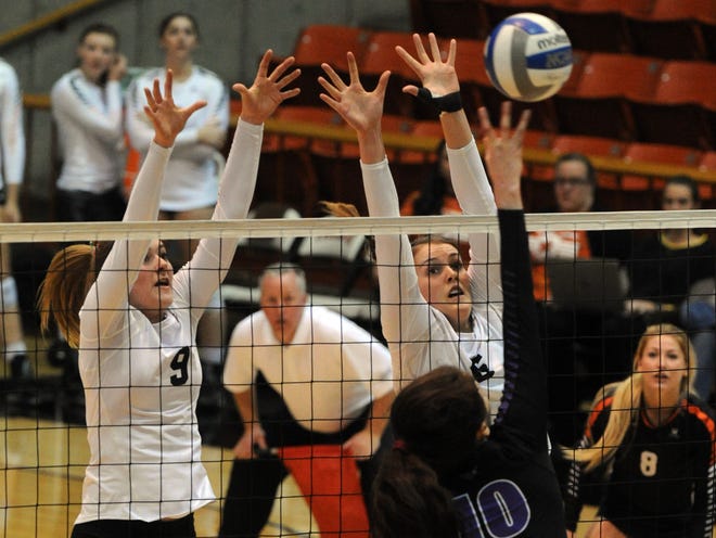 Pacific's Kimmy Whitson, 9, and Holland Crenshaw, 6, rise for a block against Portland's Emily Liger during their West Coast Conference volleyball match Thursday at Spanos Center. Pacific swept Portland 25-9, 25-16, 25-22 and Whitson had a match-high 38 assists. CALIXTRO ROMIAS/THE RECORD