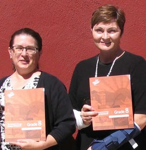 From left, Valerie Maginsky, Operation Port Jervis Pride chairperson, and Mary Decker, community liaison at Bon Secours Community Hospital, hold workbooks to be used by eighth grade students in the Too Good for Drugs Program. Photo provided
