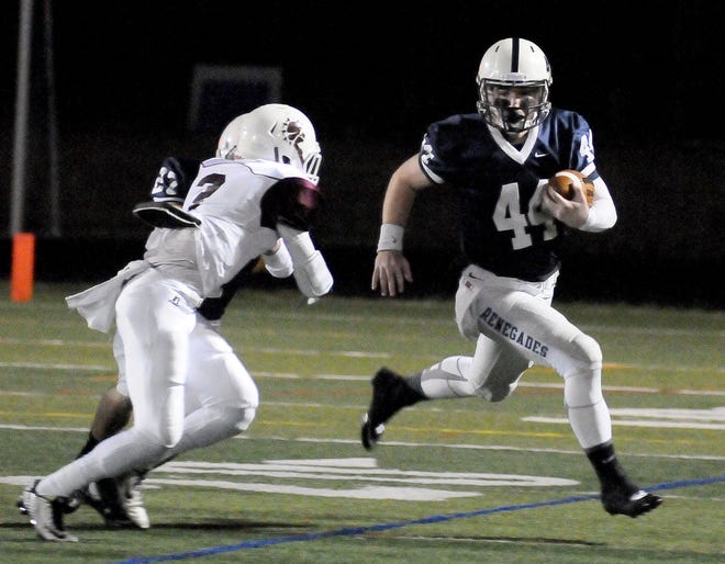 Shawnee's Michael Welsh (44) runs down field as Bridgeton's David Mosley (2) goes in for a tackle during South Jersey Group 4 football semifinals at Shawnee High School Friday Nov. 20, 2015.