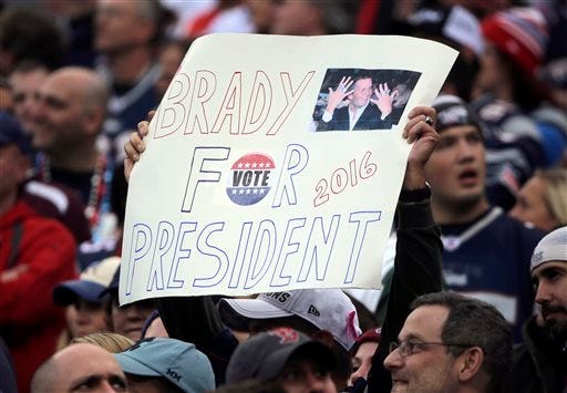 FILE - In this Oct. 25, 2015 file photo, a New England Patriots fan holds a sign that supports Patriots quarterback Tom Brady for president during an NFL football game against the New York Jets in Foxborough, Mass. GQ magazine asked Brady, its 2015 Man of the Year, if he"™s ever considered making a play for the White House or at least for governor of Massachusetts. Brady said. "There is a 0.000 chance of me ever wanting to do that." (AP Photo/Steven Senne, File)