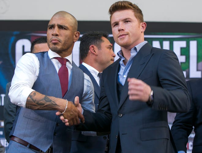 Middleweights Miguel Cotto, left, and Canelo Alvarez square off Saturday in Las Vegas. The fight was going to be for Cotto's middleweight title, but that went out the window this week when he refused to pay the $300,000 sanctioning fee to the WBC. Alvarez would be declared the WBC champion if he wins the bout, but the title would be vacant if Cotto wins. The Associated Press