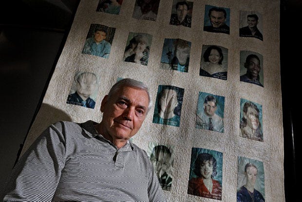 Rick Bauman is an advocate for suicide prevention. The quilt behind him represents "the faces of suicide," including his son.