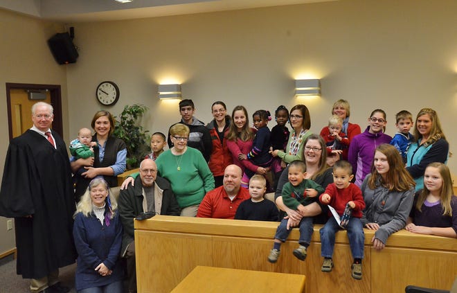 The adoptions of seven children with five families was finalized Tuesday, Nov. 25, 2014 — last year's National Adoption Day. On Tuesday, Nov. 24, nine children will be adopted at Ottawa County's Family Court. File
