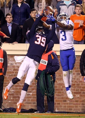 Virginia cornerback Darious Latimore (39) stops a last ditch effort by Duke wide receiver T.J. Rahming (3) to score at the end of an NCAA college football game Saturday, Nov. 21, 2015, in Charlottesville, Va. Virginia won 42-34. (Andrew Shurtleff/The Daily Progress via AP)