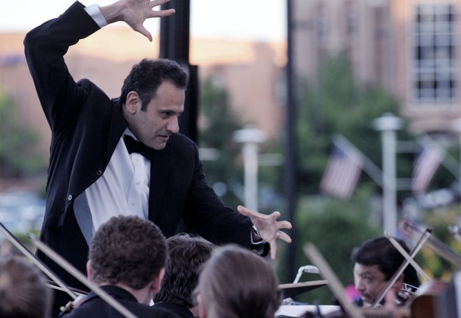 Fouad Fakhouri conducts the Fayetteville Symphony Orchestra at Festival Park.