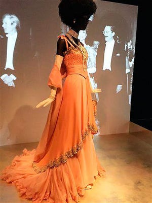 Dresses worn by French style and fashion icon Jacqueline de Ribes are displayed Monday at the Costume Institute at the Metropolitan Museum of Art in New York.