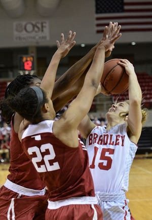 Bradley's Emily Shoo runs into a Sooner wall, getting fouled as she shoots as the Bradley Women's Basketball team battles nationally-ranked Oklahoma Sooners at the Renaissance Coliseum Sunday.