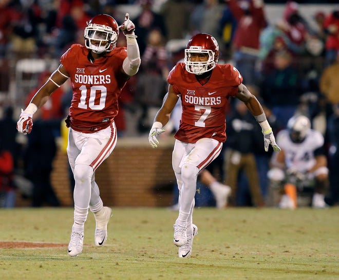 Oklahoma's Steven Parker (10) and Jordan Thomas (7) celebrate after a TCU failed two-point conversion attempt during a college football game between the University of Oklahoma Sooners (OU) and the TCU Horned Frogs at Gaylord Family-Oklahoma Memorial Stadium in Norman, Okla., on Saturday, Nov. 21, 2015. Oklahoma won 30-29. Photo by Bryan Terry, The Oklahoman