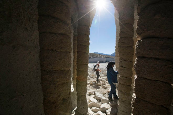 Sunlight shines through the mysterious volcanic columns on the eastern shore of Crowley Lake in Mono County, Calif. (Brian van der Brug/Los Angeles Times/TNS)