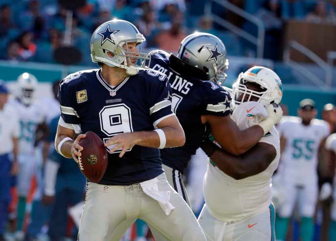 Dallas Cowboys quarterback Tony Romo looks to pass during the second half of against the Miami Dolphins on Sunday in Miami Gardens. (AP Photo/Lynne Sladky)