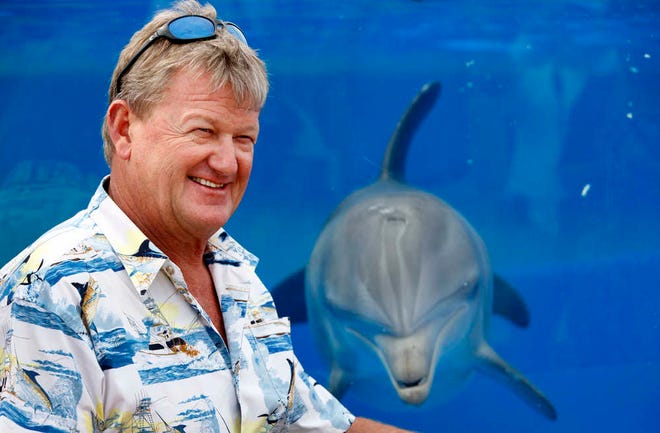 Famed marine artist Guy Harvey stands near the dolphin habitat during a visit to Marineland Thursday afternoon, October 24, 2013. Harvey delivered a $10,000 donation to the attraction. The money, from the Guy Harvey Ocean Foundation, comes from proceeds generated from Florida Lottery ticket sales of $2 scratch-off tickets designed by the artists. By DARON DEAN, daron.dean@staugustine.com
