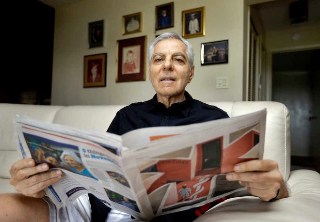 In this Nov. 17, 2015, photo, Sal Natale looks over a Medicare brochure at his home in Seminole, Fla. Rising drug costs are starting to hit Medicare's popular prescription drug program, with many senior citizens looking at double digit premium increases next year. Natale, a retired dentist, said prescription premiums for him and his wife are going up about 30 percent next year, and he doesn't see a good alternative. "I'm just going to grin and bear and hope it starts moderating," Natale said. (AP Photo/Chris O'Meara)