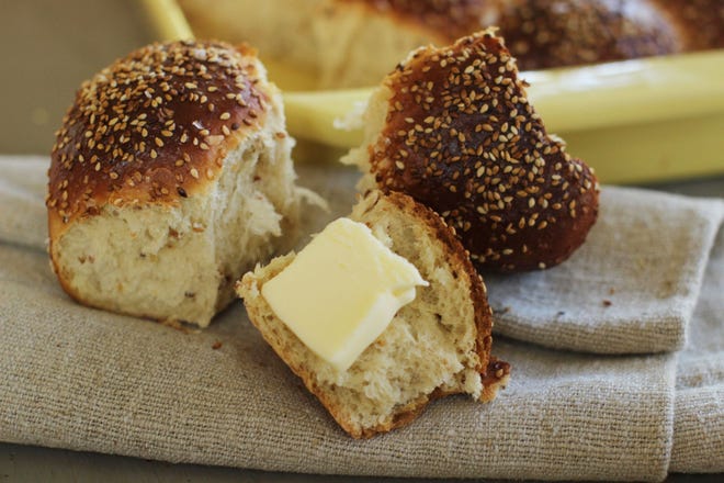 Sweet sesame dinner rolls are a cross between an Italian scali bread, a light, tender bread crusted in sesame seeds, and a Portuguese sweet roll. The Associated Press