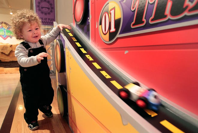 (File) Jack Gemmi, of Buckingham, plays with toy cars on a racing strip at Bucks County Children’s Museum in New Hope in 2011. The museum has signed a 10-year lease with George Michael Inc., owner of Union Square in New Hope, where the museum is located.