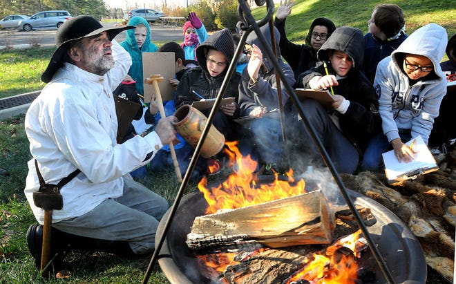 McDonald Elementary teacher Joe Pisacano teaches fifth-graders about the true hardships faced by the Pilgrims for the 17th annual Thanksgiving Fest at their Warminster school on Monday, Nov. 23, 2015.