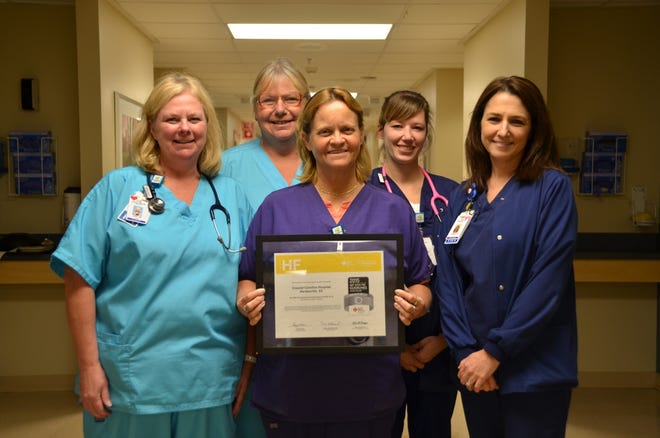 Coastal Carolina Hospital nurses in the Medical-Surgical Department show off the Get With The Guidelines - Heart Failure Silver-Plus Quality Achievement Award.