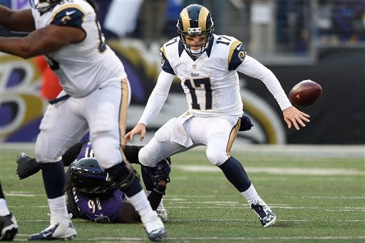 St. Louis Rams quarterback Case Keenum (17) fumbles the ball on a hit from Baltimore Ravens outside linebacker Courtney Upshaw (91) forcing a turnover during the second half of an NFL football game in Baltimore, Sunday, Nov. 22, 2015. The Ravens defeated the Rams 16-13. (AP Photo/Nick Wass)
