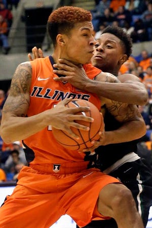 Illinois guard Khalid Lewis, left, drives against Chicago State guard Elliot Cole, right, during the first half of an NCAA college basketball game at the Prairie Capital Convention Center, Monday, Nov. 23, 2015, in Springfield, Ill. (AP Photo/Seth Perlman)
