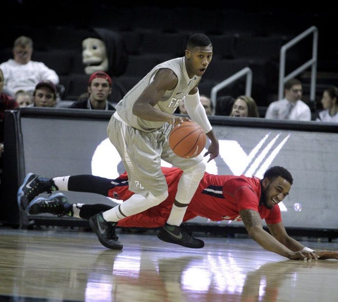PC's Kris Dunn grabs the ball after NJIT forward Ky Howard trips.