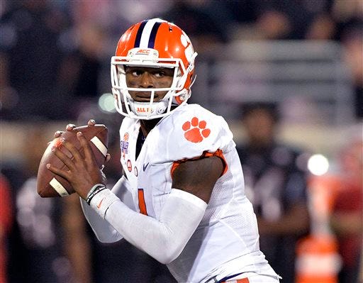 FILE - In this Sept. 17, 2015, file photo, Clemson quarterback Deshaun Watson looks for a receiver during the second half of an NCAA college football game against Louisville in Louisville, Ky.
