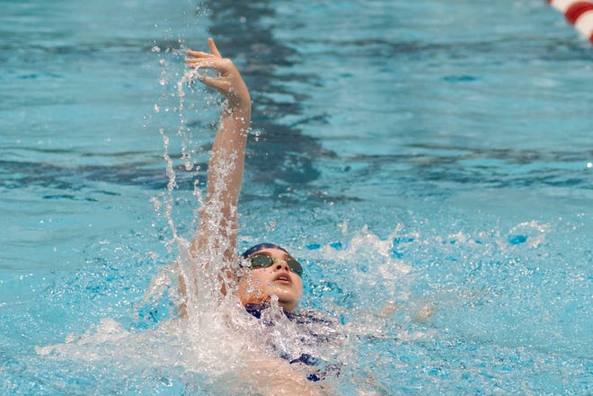 Walpole senior Julia Muller does the backstroke in the 200-yard individual medley race during the MIAA Division 2 State Championship at Harvard University on Sunday. Wicked Local Staff Photo/Sam Goresh