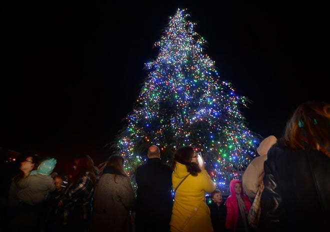 Guests react to the lighting of the Christmas tree in downtown Spartanburg. The city of Spartanburg celebrated the holiday season with the annual 'Dickens of a Christmas' event in downtown Spartanburg on Dec. 2, 2014.
