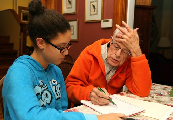 Tutor Jim Barr, of Wellesley, works on an Algebra II problem with Wellesley High School sophomore Cassidy Bartolomei, 15, who is part of "A Better Chance." Wicked Local Staff Photo/Ann Ringwood