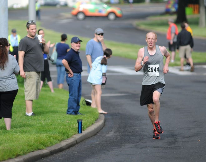 Steve Hallman placed first overall during the 17th Annual Courier-Kiwanis Sesame Place Classic 2015 5K with a time of 16:52 on Sunday, May 17, 2015, at Sesame Place in Middletown.