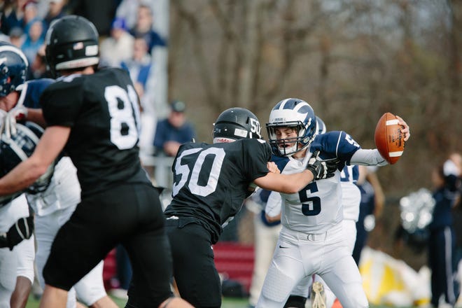 Bryan Grafe of the football Magicians sacks Swampscott's Colin Frary during the annual Thanksgiving game at Marblehead High School Nov. 26. The Magicians were all over their Big Blue rivals to the tune of 51-0. Wicked Local Photo / Jared Charney