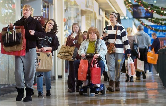 (File) Holiday shoppers find bargains at the Oxford Vallley Mall Friday Nov. 25, 2011.