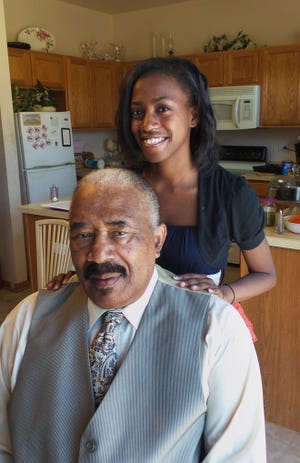 Vanyce Grant poses with her grandfather Bernie Stuart at her home in Bolingbrook, Ill., on Nov. 19, 2015. Grant interviewed Stuart for StoryCorps' Great Thanksgiving Listen oral history project. High school students across the country are participating.