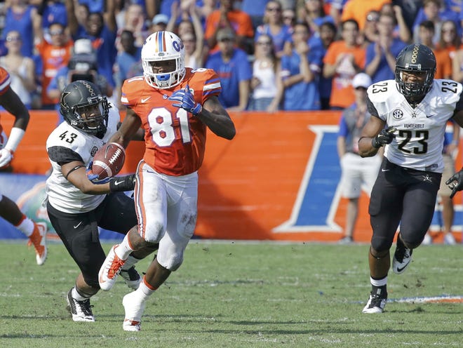 Florida's Antonio Callaway (81) returns a punt for 28-yards as he gets past Vanderbilt linebackers Jordan Griffin (43) and Khari Blasing (23) during the second half of an NCAA college football game, Saturday, Nov. 7, 2015, in Gainesville, Fla. Florida won 9-7.