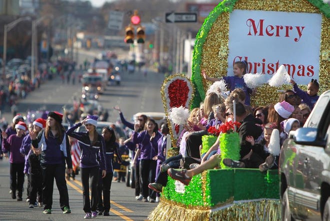 Kids of Perfect Step Dance Studio march next to their float in the Gastonia Christmas Parade on Franklin Boulevard in 2012. This year's parade will be at 2 p.m. Dec. 6 on Main Avenue.