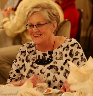 Photo by Jake West/New Jersey Herald - Bev Bathgate enjoys a dinner surounded by family and friends during her retirement party, on Friday, November 14, 2015, at the Lafayette House, in Lafayette Township
