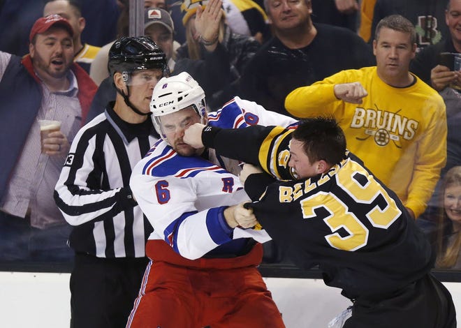 New York's Dylan McIlrath and Boston's Matt Beleskey fight during the second period.
