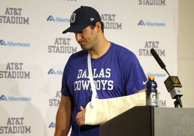 Cowboys quarterback Tony Romo leaves the podium after talking to the media Thursday. The Associated Press