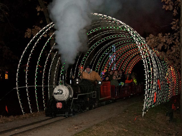 BRIAN MCMAHEN • TIMES RECORD Vernon Pullman, maintenance technician for the Fort Smith Parks and Recreation Department, runs the steam-powered train at Creekmore Park’s Holiday Express in Fort Smith on Monday, Dec. 1, 2014. Aaron Lee, Creekmore Park’s Administrative Secretary said after Monday night’s initial run, the steam engine will be replaced by the diesel-powered engine and run Monday through Saturday, 5:30 p.m. to 8:30 p. m. until December 20th. 
 BRIAN MCMAHEN • TIMES RECORD Coraline Salazar, age 3, of Fort Smith, visits with Santa, Bill Willis of Van Buren, at Creekmore Park’s Holiday Express in Fort Smith on Monday, Dec. 1, 2014. Coraline is the daughter of Elizabeth Salazar and Manuel Perez, both of Fort Smith. 
 TIMES RECORD FILE PHOTO Holiday lights are seen at the Fort Smith River Park, one of the local parks that displays lights and decorations each December.