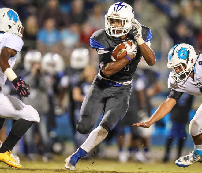 Gary McCullough For The Times-Union Clay's Bilal Ally finds running room during the first half of a Class 5A regional final against Nature Coast Technical on Friday night at Clay High School. Ally ran for 317 yards and three touchdowns.