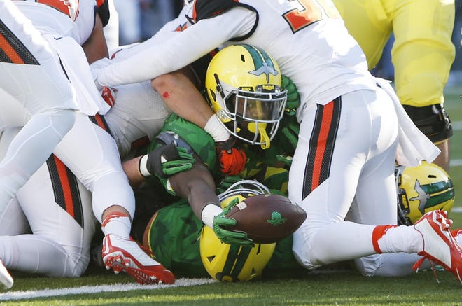 Oregon running back Royce Freeman reaches the goal line for an Oregon score during the second quarter of the 119th Civil War football game at Autzen Stadium in Eugene on Friday, November 27, 2015. (Andy Nelson/The Register-Guard)