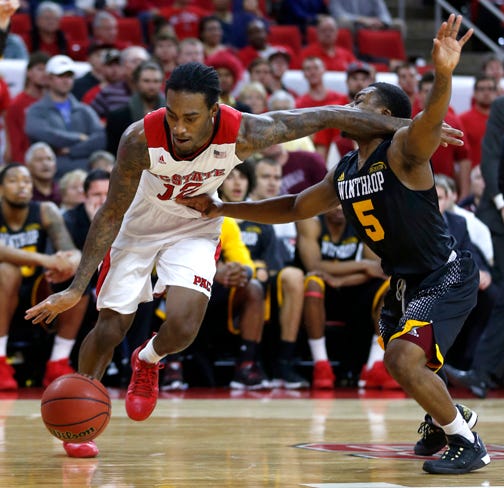 N.C. State point guard Cat Barber makes a move around Winthop's Keon Johnson during Friday night's game.