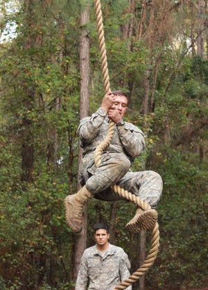 A 3rd Infantry Division soldier hustles up a rope Wednesday morning during the Thornsbury Challenge at Fort Stewart. The endurance and problem-solving challenge, named for Special Forces Sgt. 1st Class Duane Thornbury, was part of the many competitions and ceremonies happening during the division's Marne Week. (Dash Coleman/Savannah Morning News)