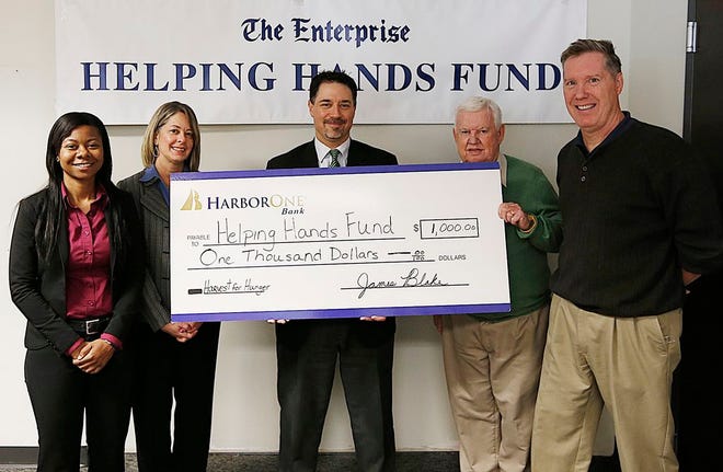HarborOne Bank came to The Enterprise newsroom to donate $1,000 to The Enterprise Helping Hands Fund/Jingle Bell Run to help kick off this year's charitable campaign. From left are Legion Parkway branch manager Karen Dor, West branch manager Linda Grande, Montello branch manager John Polvere, Jingle Bell Run director Dave Gorman, and Enterprise managing editor Steve Damish. The Jingle Bell Run is set for Dec. 5.