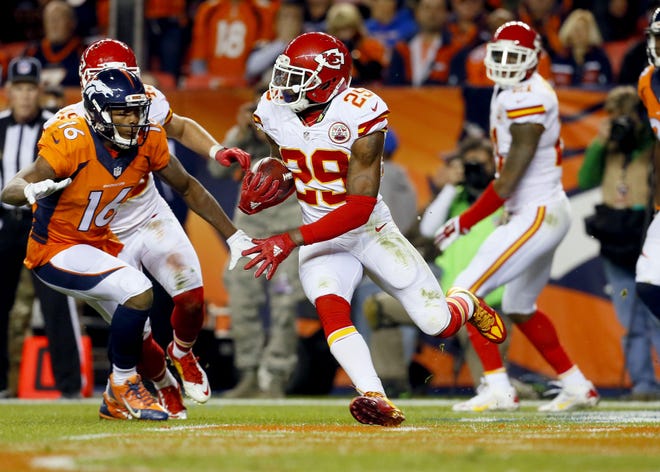 FILE - In this Nov. 15, 2015 file photo, Kansas City Chiefs free safety Eric Berry (29) runs back an interception against the Denver Broncos during the second half of an NFL football game, in Denver. During their four-game win streak, the Chiefs have benefited from some of their biggest stars finally getting back to speed. Derrick Johnson is resembling a Pro Bowl linebacker again after he tore his Achilles tendon last season, while Berry likewise looks like a Pro Bowl safety less than a year removed from a cancer diagnosis that required chemotherapy. (AP Photo/Joe Mahoney, File )