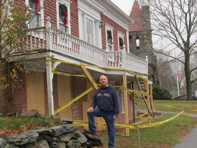 James Faria of 93 Main St., where his early 18th century home will need more than $80,000 of work to repair damage done the front, where stone and glass broke windows and littered the family room after a town man's SUV drove into it on Oct. 10.