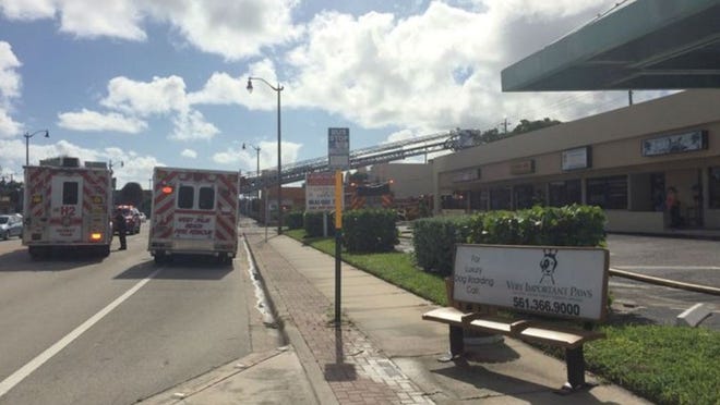Almarco Laundromat was heavily damaged after the ceiling caught fire Sunday afternoon, engulfing the business in flames, West Palm Beach Fire Rescue officials say.
