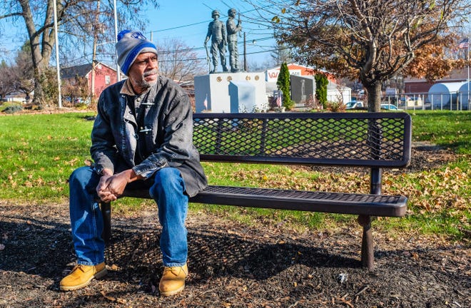Edgar Walters sits on a bench at Veteran's Memorial Park.